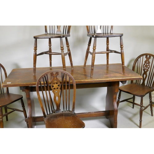 1113 - A set of five wheelback kitchen chairs and oak refectory style table, with solid top, early C20th, 6... 