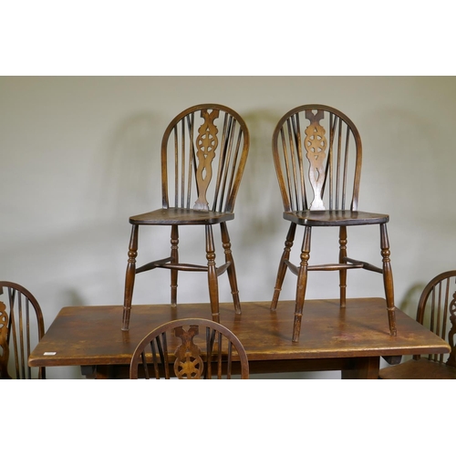 1113 - A set of five wheelback kitchen chairs and oak refectory style table, with solid top, early C20th, 6... 