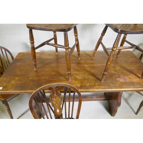 1113 - A set of five wheelback kitchen chairs and oak refectory style table, with solid top, early C20th, 6... 