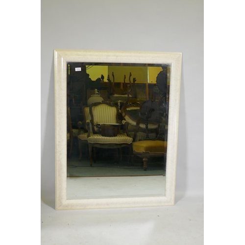 1114 - A large contemporary wall mirror with a marble style frame, 91 x 117cm