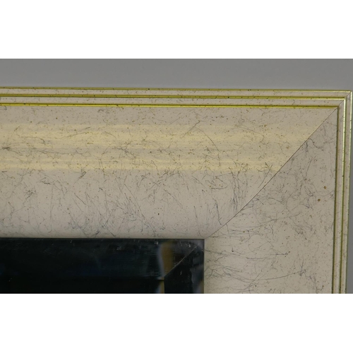 1114 - A large contemporary wall mirror with a marble style frame, 91 x 117cm