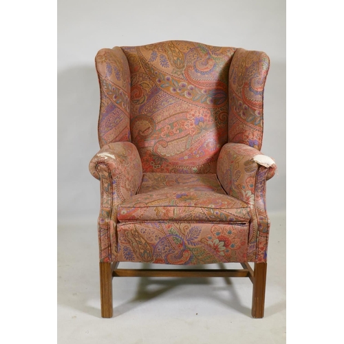 1116 - A Georgian style wingback armchair