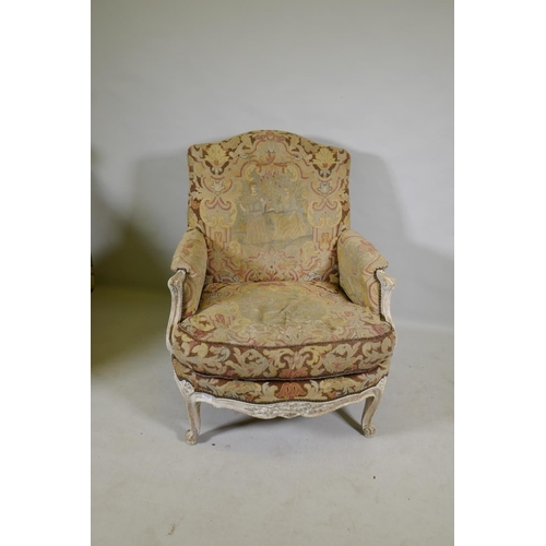 1117 - An C18th style French carved and painted beechwood framed arm chair with tapestry covers