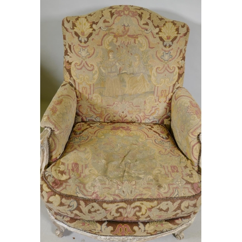 1117 - An C18th style French carved and painted beechwood framed arm chair with tapestry covers