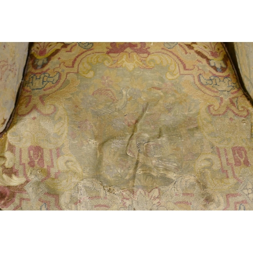 1117 - An C18th style French carved and painted beechwood framed arm chair with tapestry covers