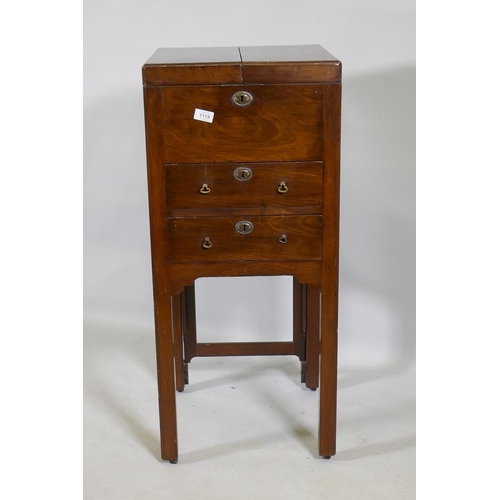 1119 - A Georgian mahogany gentleman's washstand, the fold out top with fitted interior and turned wood bow... 