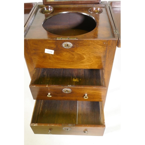 1119 - A Georgian mahogany gentleman's washstand, the fold out top with fitted interior and turned wood bow... 