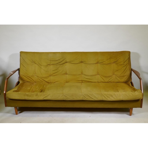 1120 - A mid century teak sofa bed in the manner of Greaves & Thomas, structurally sound, upholstery AF... 