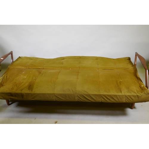 1120 - A mid century teak sofa bed in the manner of Greaves & Thomas, structurally sound, upholstery AF... 