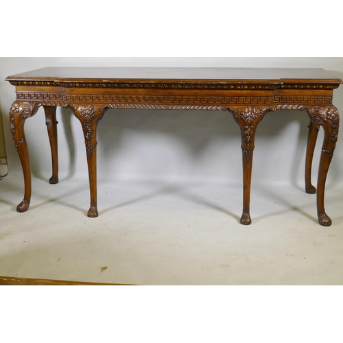 1123 - A pair of Georgian style mahogany breakfront serving tables, with key pattern frieze and carved cabr... 