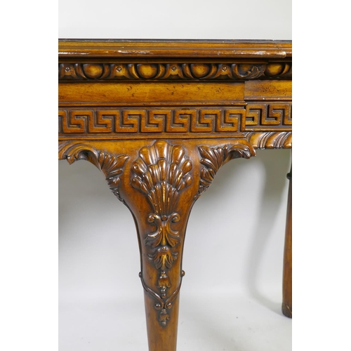 1123 - A pair of Georgian style mahogany breakfront serving tables, with key pattern frieze and carved cabr... 