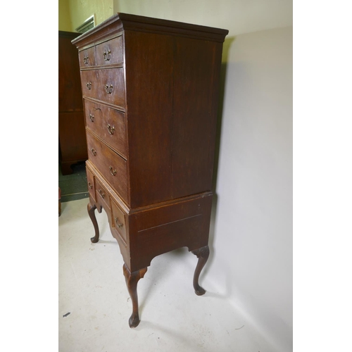 1124 - A Georgian oak chest on stand, the upper section with two over three drawers, the base with three dr... 