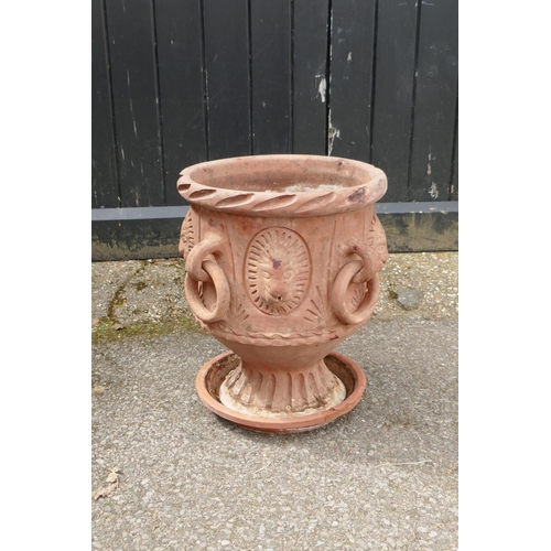 1131 - A C19th terracotta urn with four loop handles and lion mask decoration, 41cm high, 34cm diameter