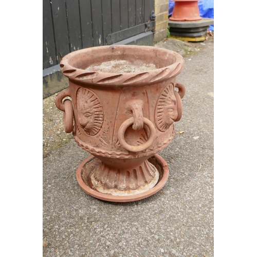 1131 - A C19th terracotta urn with four loop handles and lion mask decoration, 41cm high, 34cm diameter