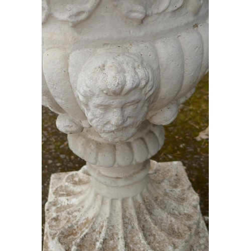 1133 - A painted reconstituted stone garden planter with twin mask decoration, by Papinia, 61cm high, 39cm ... 