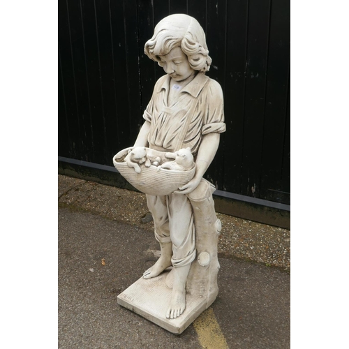 1135 - A painted reconstituted stone/concrete garden figure, boy with two puppies, 120cm high