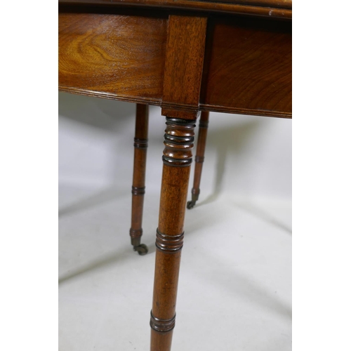 1138 - A pair of Georgian mahogany demi lune side tables with moulded edge tops, raised on ring turned tape... 