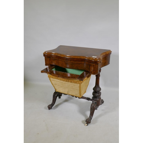 1139 - A Victorian serpentine shaped burr walut work box/games table, the top opening to reveal a chequer b... 