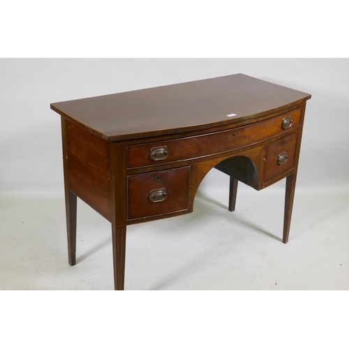 1141 - C19th mahogany three drawer bow fronted kneehole dressing table/desk, with original plate handles, r... 