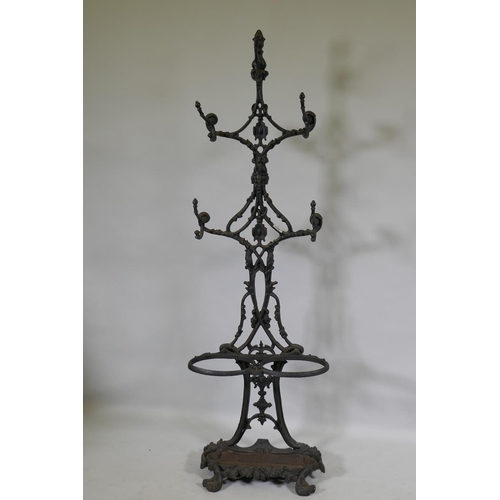 1142 - A painted cast iron stick and hat stand, 137cm high