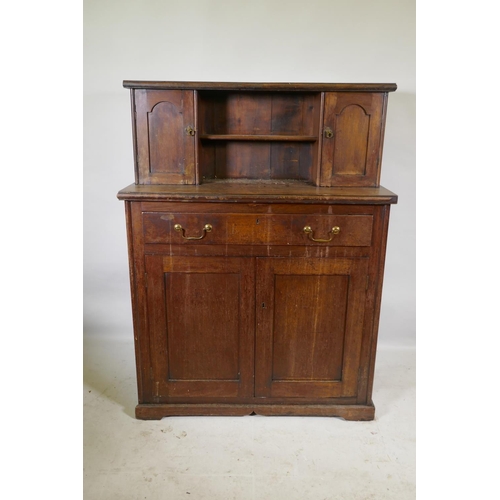 1147 - A C19th mahogany chiffonier, with two cupboards flanking a pen shelf, and a single drawer over two c... 