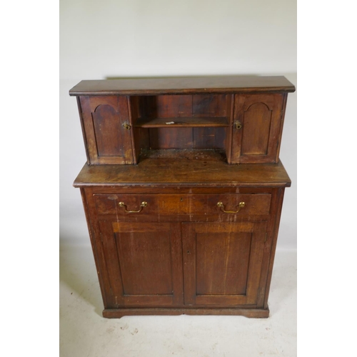 1147 - A C19th mahogany chiffonier, with two cupboards flanking a pen shelf, and a single drawer over two c... 