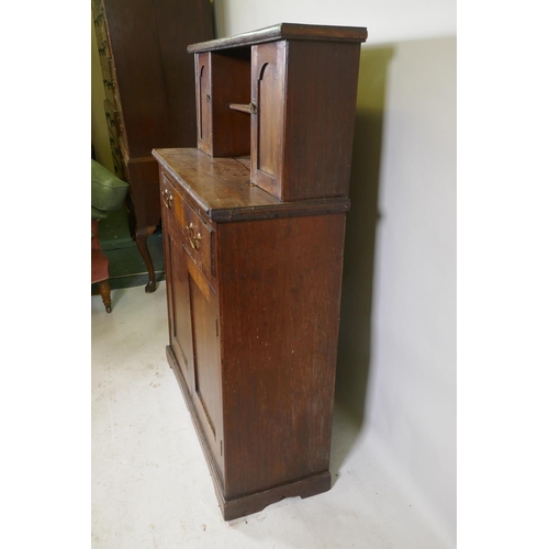 1147 - A C19th mahogany chiffonier, with two cupboards flanking a pen shelf, and a single drawer over two c... 