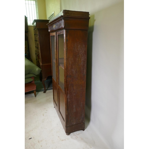 1151 - A C19th French mahogany two door cupboard with wire grilled doors, 97 x 35 x 166cm