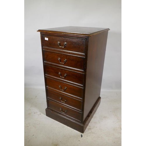 1153 - A mahogany three drawer filing cabinet, 56 x 62 x 101cm