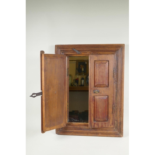 1154 - A hardwood mirror in the form of shutters, 44 x 59cm