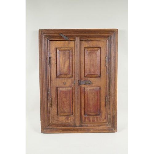 1154 - A hardwood mirror in the form of shutters, 44 x 59cm