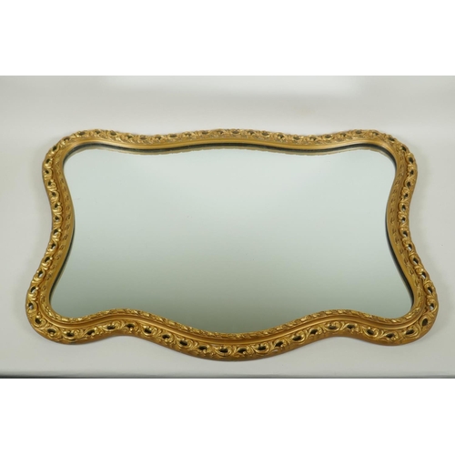 1156 - A shaped gilt wall mirror, 68 x 48cm