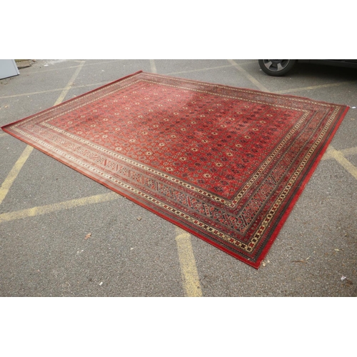 1159 - A large Belgian red ground wool rug with Persian design, 294 x 366cm