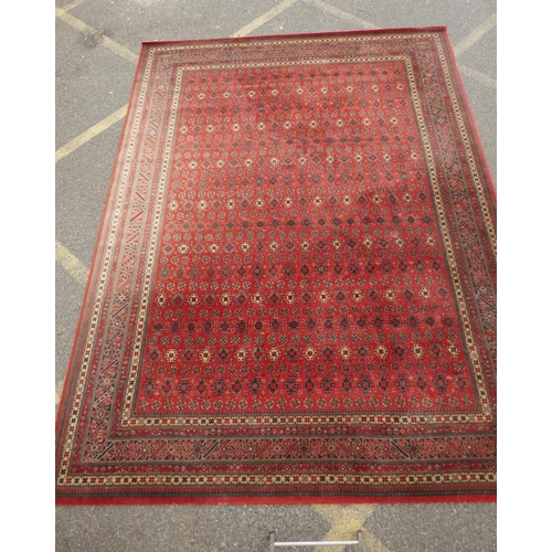 1159 - A large Belgian red ground wool rug with Persian design, 294 x 366cm