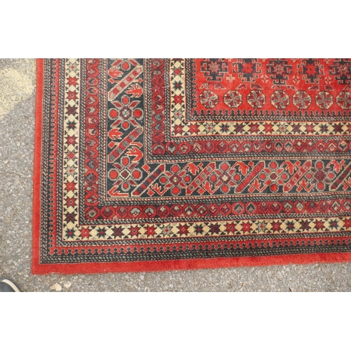 1159 - A large Belgian red ground wool rug with Persian design, 294 x 366cm