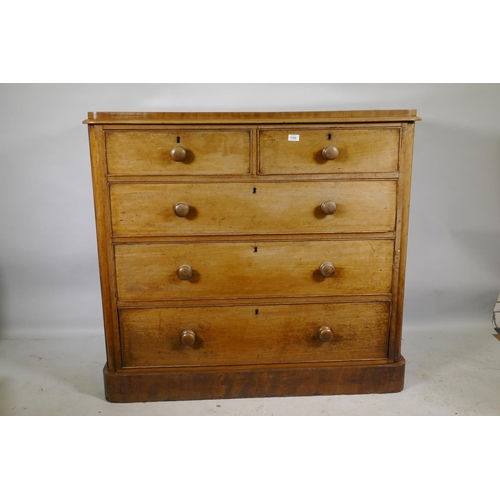 1162 - A Victorian faded mahogany chest with two over three drawers, and original wood handles, raised on p... 