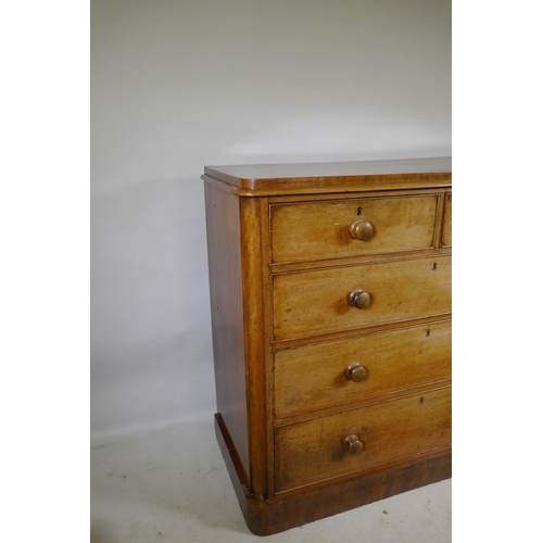 1162 - A Victorian faded mahogany chest with two over three drawers, and original wood handles, raised on p... 