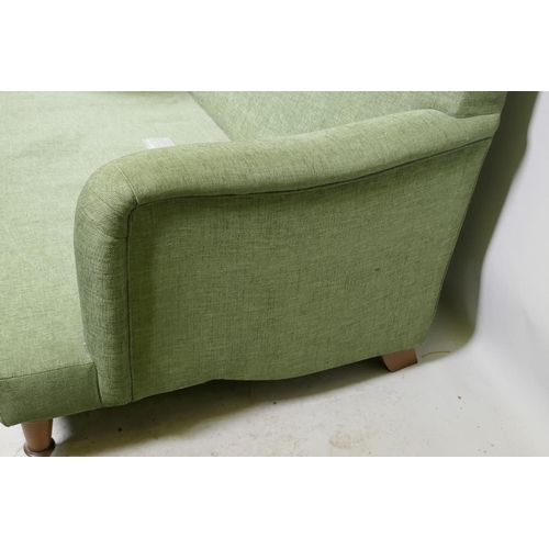 1166 - A Howard style two seater settee in green linen upholstery, 170cm wide