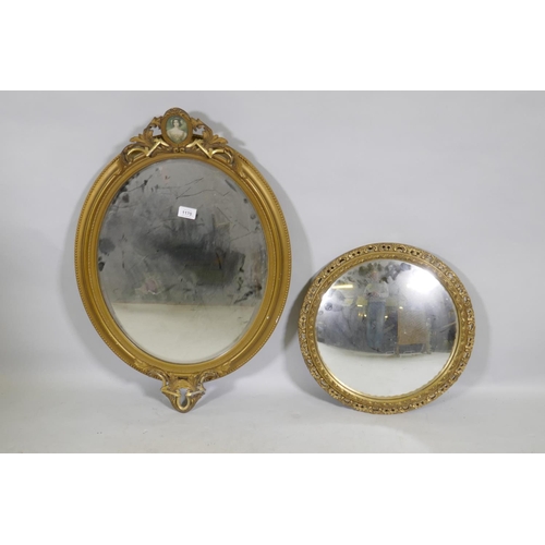 1170 - A vintage gilt oval wall mirror, 72cm high, and a later circular convex mirror