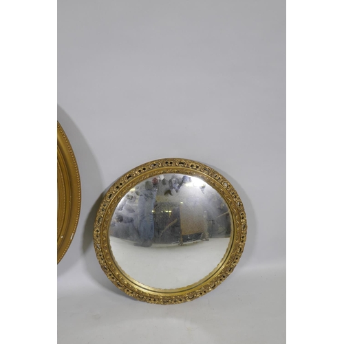 1170 - A vintage gilt oval wall mirror, 72cm high, and a later circular convex mirror