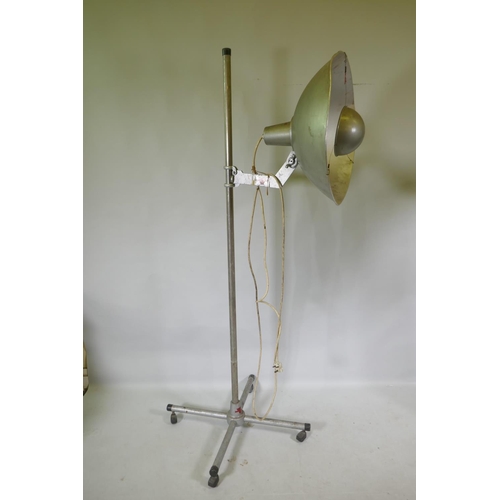 1172 - A pair of industrial RRB floor standing studio lamps, and a similar Malham lighting equipment SE23 s... 