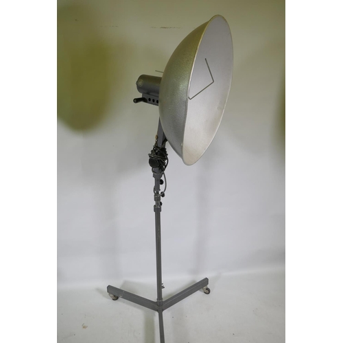 1172 - A pair of industrial RRB floor standing studio lamps, and a similar Malham lighting equipment SE23 s... 