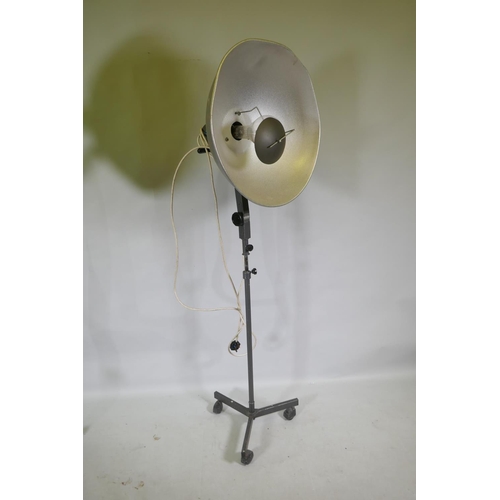 1172 - A pair of industrial RRB floor standing studio lamps, and a similar Malham lighting equipment SE23 s... 