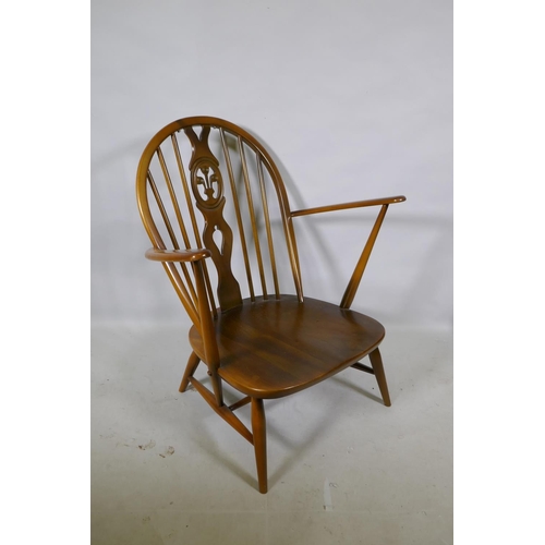 1176 - A vintage Ercol elm Fleur de Lys armchair