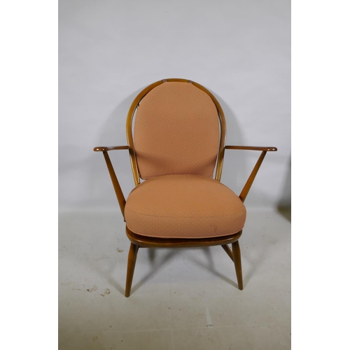 1176 - A vintage Ercol elm Fleur de Lys armchair