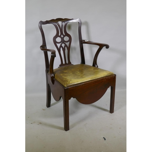 1182 - A Georgian mahogany Chippendale style elbow chair with pierced splat back, scroll arms and drop in l... 