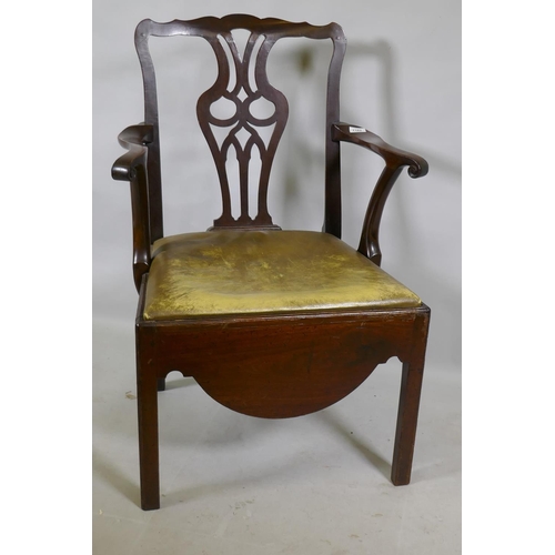 1182 - A Georgian mahogany Chippendale style elbow chair with pierced splat back, scroll arms and drop in l... 