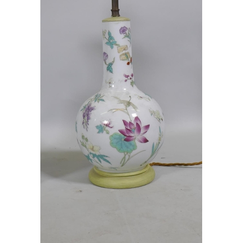 120 - A Chinese porcelain lamp with butterfly and floral decoration, 50cm high, and another smaller