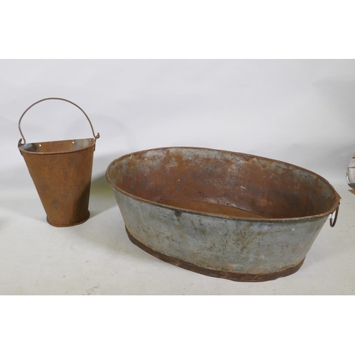 1201 - A galvanised metal oval trough and a half gallon hopper, 82 x 62cm