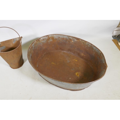 1201 - A galvanised metal oval trough and a half gallon hopper, 82 x 62cm